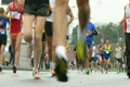 Marathon participants during run in rainy weather
