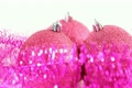 Christmas tree balls rotate, surrounded by tinsel