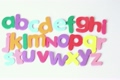 Multicolored letters arranged in three lines