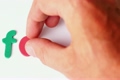 Hand put letters until they are form word FATHER