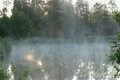 mist raising over pond