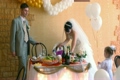 bride, bridegroom and girls with balloons