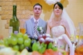 bridegroom and bride sits at wedding table