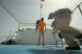 family is playing basketball on playground